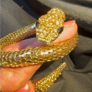 Golden Serpent Statement Bracelet 
Bold arm cuff with shimmering scales